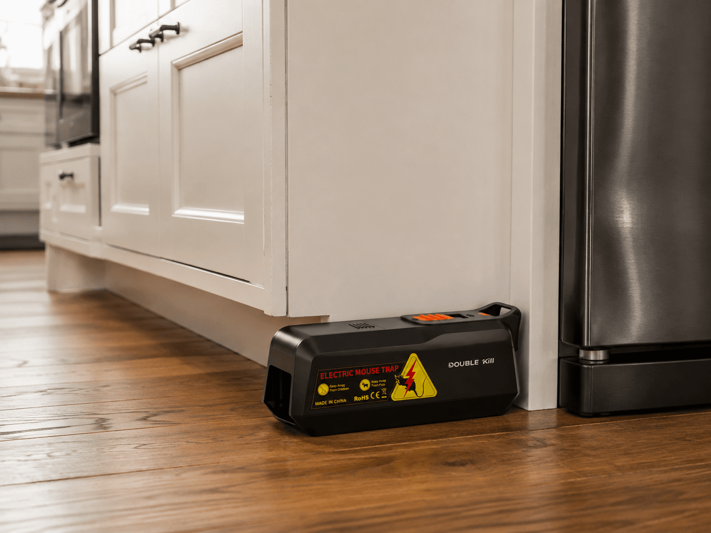 Electric Mouse Trap positioned along a kitchen wall